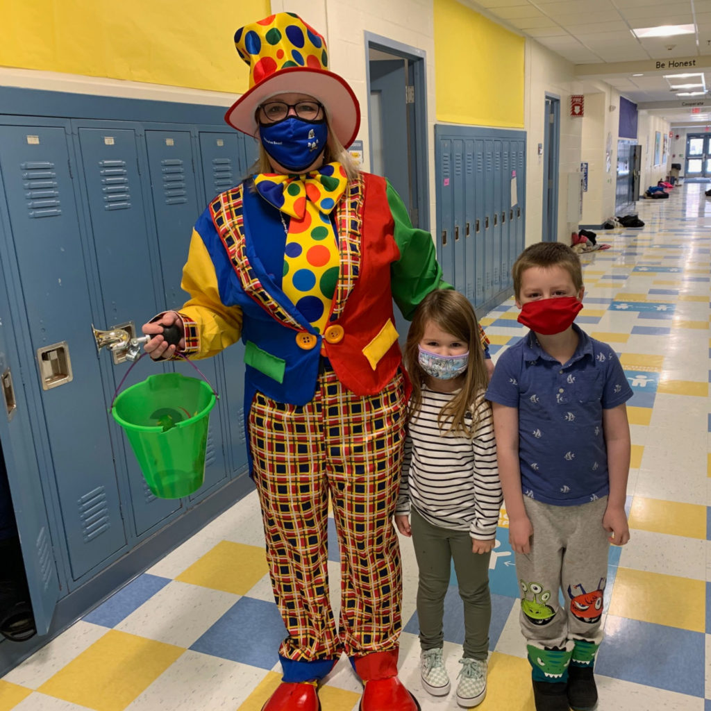 Featured image of article: Litter-A-C the Clown Visits With AES Students