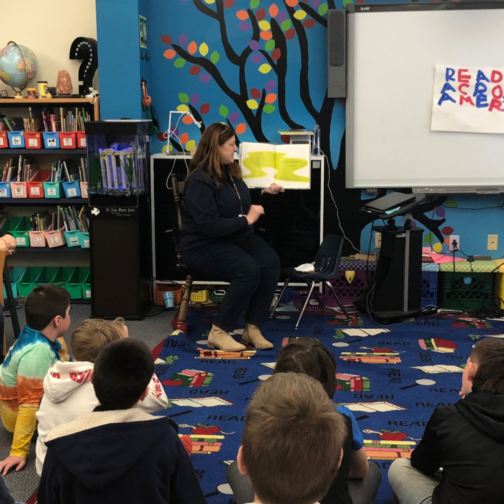 Featured image of article: Dr. Saunders Reads to AES Students