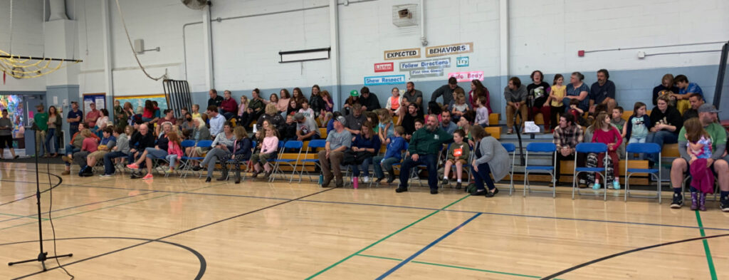 Featured image of article: AES families gather in the gym for Open House!