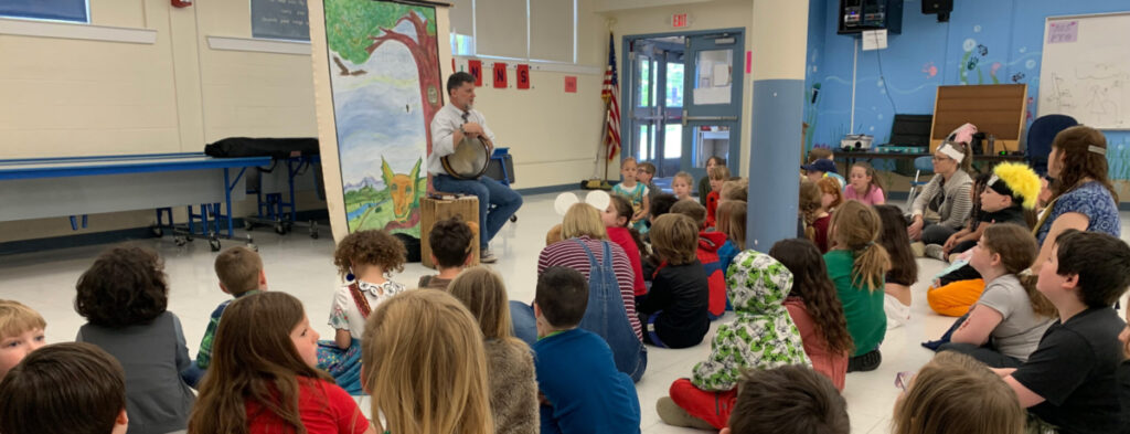 Featured image of article: Simon Brooks, storyteller, shares his talents with AES students. This visit was a result of a CLIF grant and Tuttle Library.